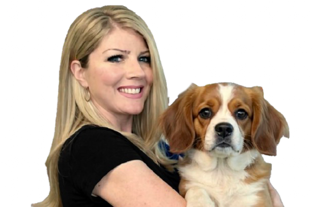 Amie O'Day holding a Cavalier King Charles Spaniel